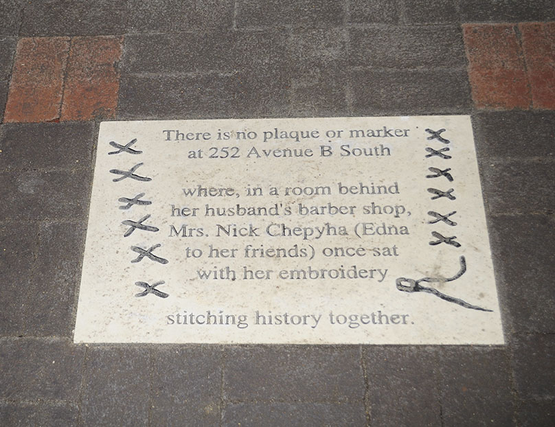 20th st plaque inlaid in the new sidewalk showing poetry of local author Candace Savage 