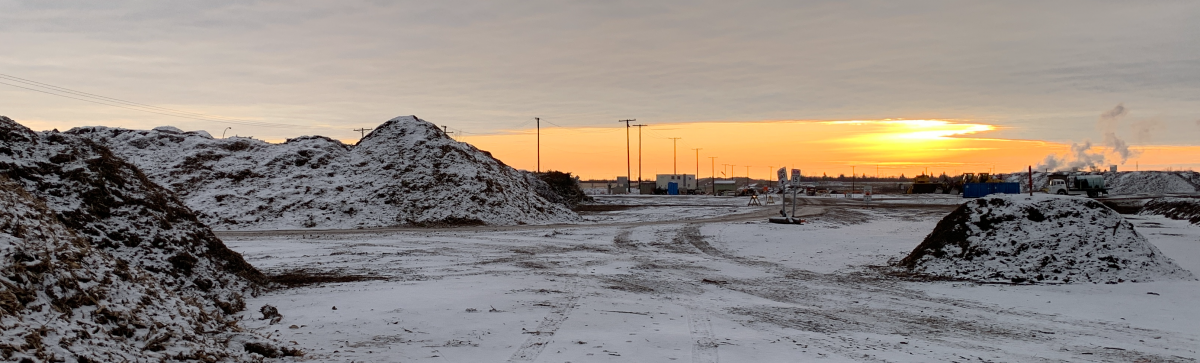 Compost depot at dusk in winter