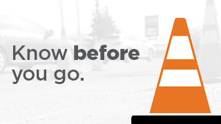 Graphic of a construction pylon with text "Know before you go"