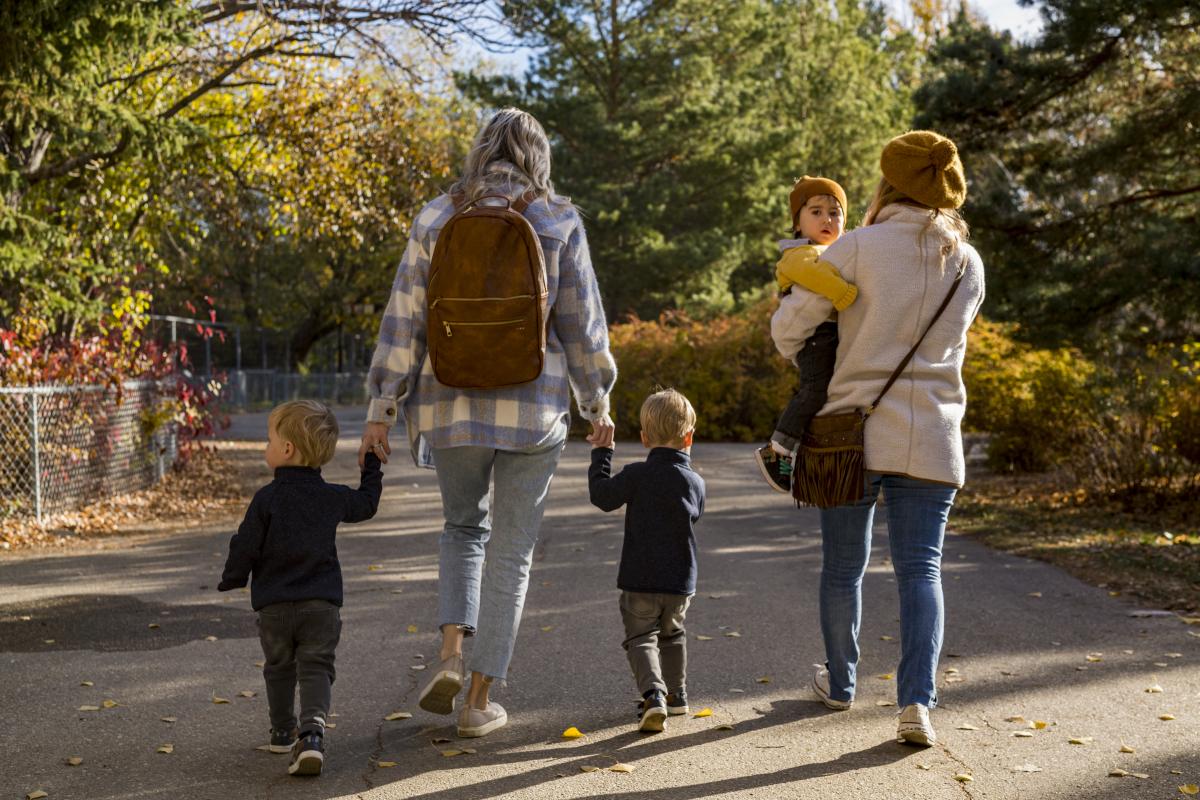 family walking through park
