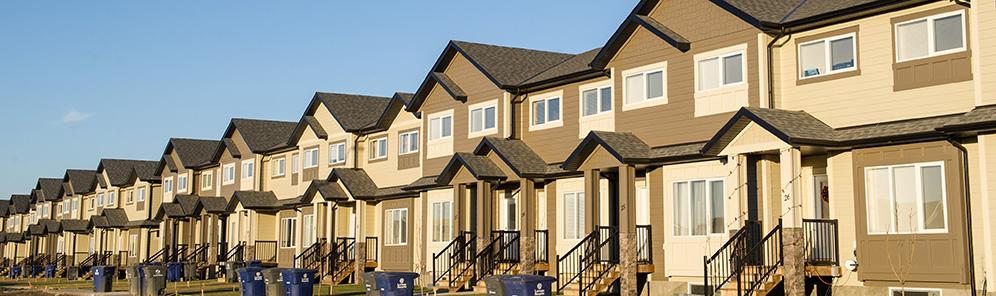 Row of tan coloured attached houses