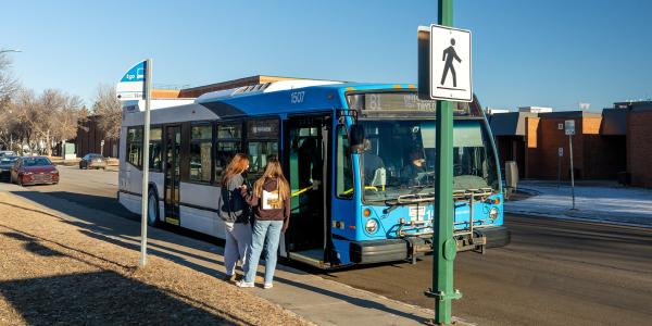 Bus stop with passenger waiting to board